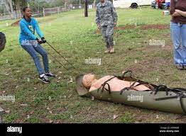 Mamiana Moore, Moanalua High School, experiences how difficult it can be to  move an injured patient Stock Photo - Alamy