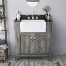 A farmhouse vanity is a vanity that has a rustic appearance to it. Magick Woods Arcadian 31 W X 19 D Vanity And Jet Black Granite Vanity Top With Rectangular Farmhouse Style Bowl At Menards