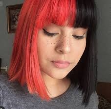 Short red hair with a touch of black looks great, when you get it styled in layers or asymmetrical chops. Paris Split Hair Color Black And Red