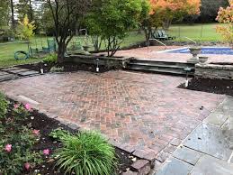 Red Brick Patio With Stairs And Pool