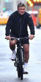 Alec Baldwin rides his bike then shops with wife Hilaria and.