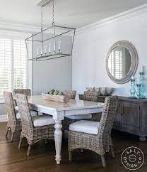 whitewashed dining table with wicker