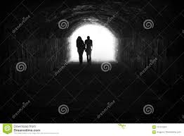 Couple And Light In The End Of The Tunnel Stock Photo