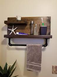 The big items can be hidden inside a cabinet or they can sit on the counter next there are lots of different bathroom shelf ideas to choose from. Pin By Tanya Barnes On Bathroom Decoration Small Towel Holder Bathroom Wall Towel Racks Wood Bathroom