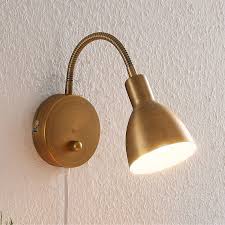 movable wall light in antique brass
