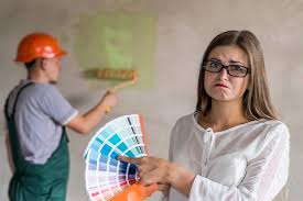 Woman Choosing Color For Painting Walls