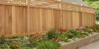 The dark wood of the fence and the outbuilding weathered by time are. Landscape Fence Ideas And Gates Landscaping Network