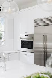 white shaker cabinets with stainless