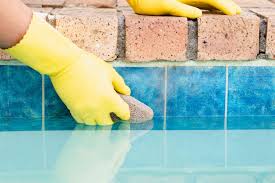 Always pour chemicals into water so that if a splash should occur, the water will splash upward but the chemicals will not. Cleaning Water Line Tile In Swimming Pool