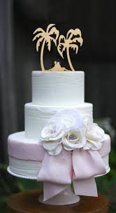While your cake should fit in with the general theme of your wedding style and decorations, there are numerous ideas you can use to make beach wedding cakes unique. Beach Theme Wedding Cake Topper Bride And Groom Siting On The Beach Wood Cake Topper Wedding Decoration Event Party Decoration Cake Decorating Supplies Aliexpress