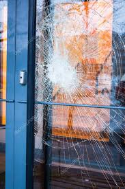 broken glass front door stock photo by