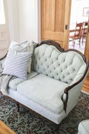 In contrast, the green color on the walls and the green and pink window treatments and sofa colors add an element of fun into the decor. How To Chalk Paint Upholstery Antique Sofa Makeover Farmhouse On Boone