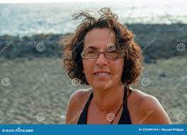 Portrait of Pretty Tanned Mature Woman with Glasses Stock Photo - Image of  camera, hair: 275399794