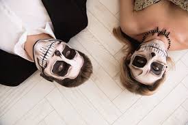 premium photo couple with skull make