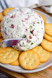cheese ball on a plate with ers