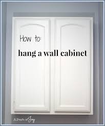 how to hang a wall cabinet the easy way