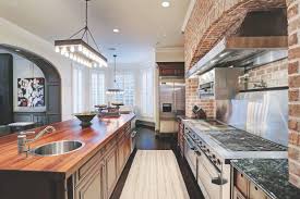 Gourmet Kitchen With Exposed Brick Wall