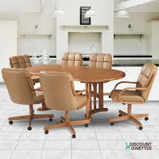 Transitional style, rectangular dining table is paired with a slat back side chair that features a fabric header that. Natasha Swivel Tilt Caster Wood Dining Set Douglas Casual Living Discount Dinettes