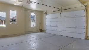 Empty Garage With White Doors As Well