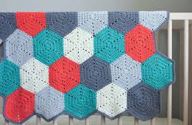 Make a warm afghan for your living room or bedroom by using a crochet afghan pattern. Happy Hexagons Free Crochet Afghan Pattern Make Do Crew