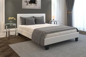 white queen platform bed in the beds