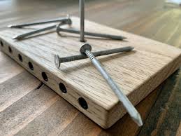 handmade wooden nail balancing puzzle