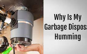 why is my garbage disposal humming