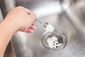 a drain with baking soda and vinegar
