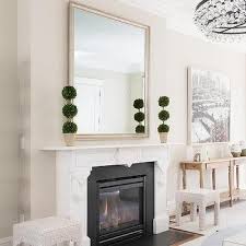 Black Mirror Over White Fireplace
