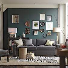 green behind a charcoal sofa