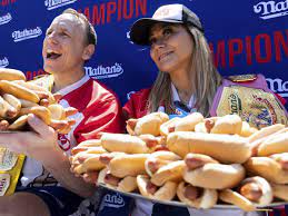 Joey Chestnut eats 63 hot dogs ...