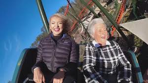 grandmother rides roller coasters to