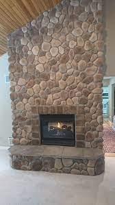 Stone Veneer Over A Brick Fireplace