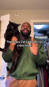 man holding black cat on tiktok