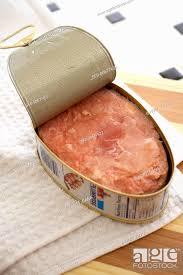 canned ham opened on a cutting board