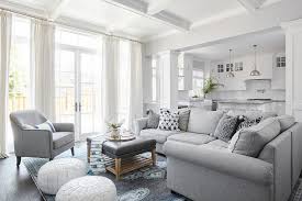 gray sectional with gray and blue rug