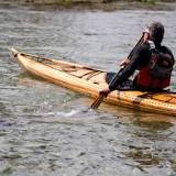 How do you paddle with a Greenland paddle?