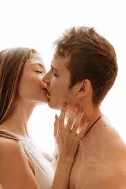 intimate young couple kissing stock photo