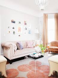peach eclectic living room with framed