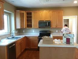 Glossy White Paint On Honey Oak Kitchen