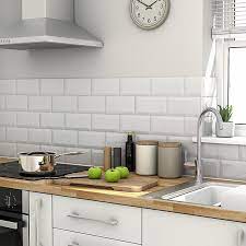 White subway tile covers the entire wall over the sink. Trentie White Gloss Metro Ceramic Wall Tile Pack Of 40 L 200mm W 100mm Diy At B Q