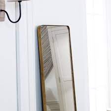 tall brushed gold framed wall mirror