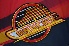 A similar version of this logo is used as their shoulder patches and for their third jerseys. Vancouver Canucks Flying Skate Gradient Jersey Red L Ccm Alternate Third 95 97 1747752852