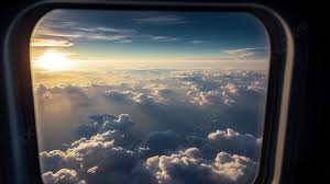 an airplane window showing clouds and