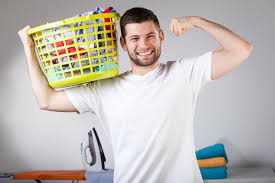 a man and a basket of clothes