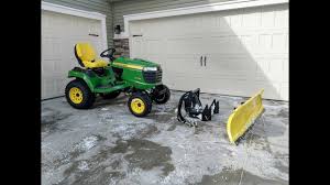 attaching a plow to a riding lawn mower