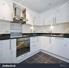 modern white kitchen black granite