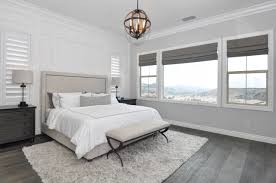 bedroom with dark hardwood flooring