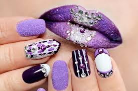 purple nail design and lip makeup