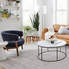 Another way to draw the eye to the modern coffee table? Streamline Round Coffee Table Marble